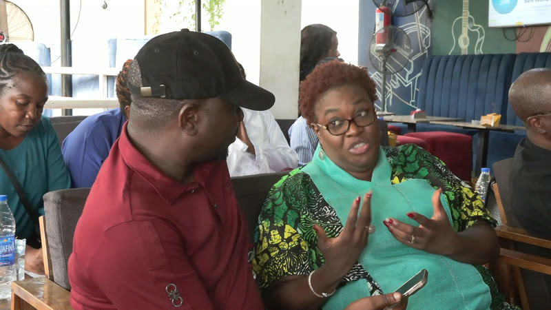 Two members deep in conversation at a table